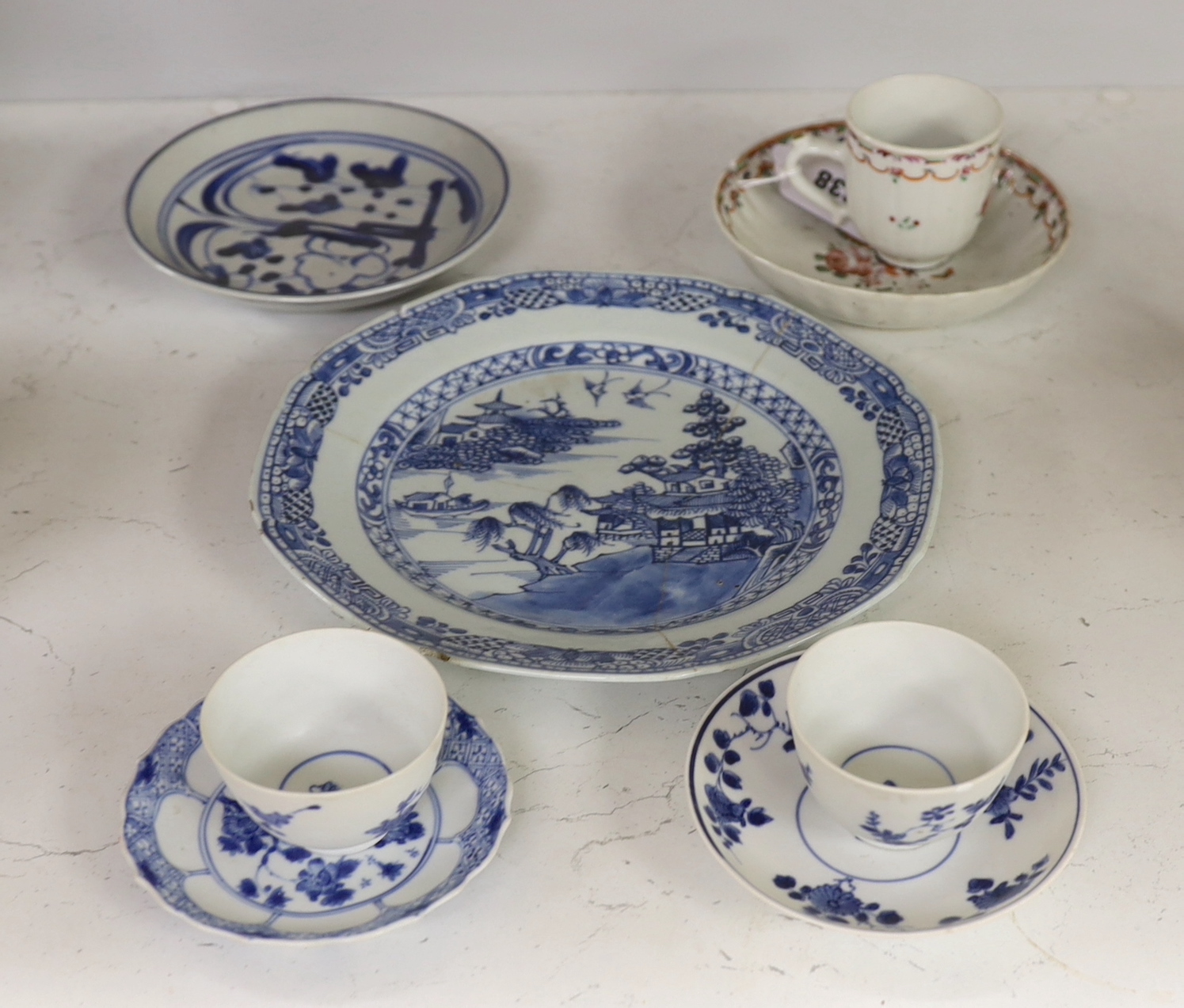 An 18th century Chinese export famille rose teacup and saucer, a similar blue and white octagonal dish, two teabowls and saucers and a plate, largest 23cm